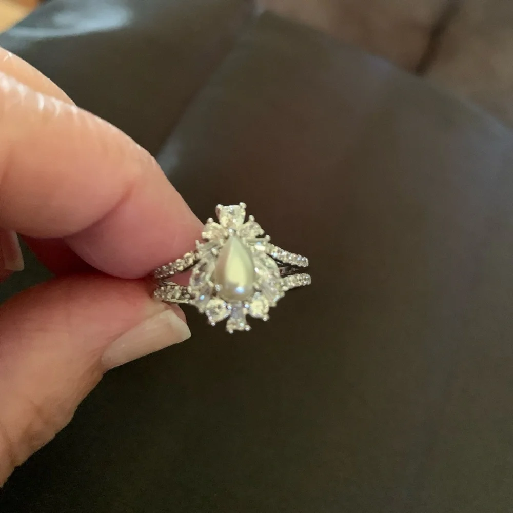 Silver tone teardrop shape faux pearl ring with crystals